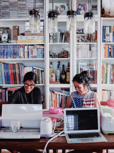 two-women-working-together-on-their-small-business-modern-day-home-based-business-start-up-company_t20_W7PnzY